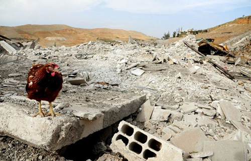 Cảnh đổ nát tại Syria sau cuộc không kích của Israel ảnh 4